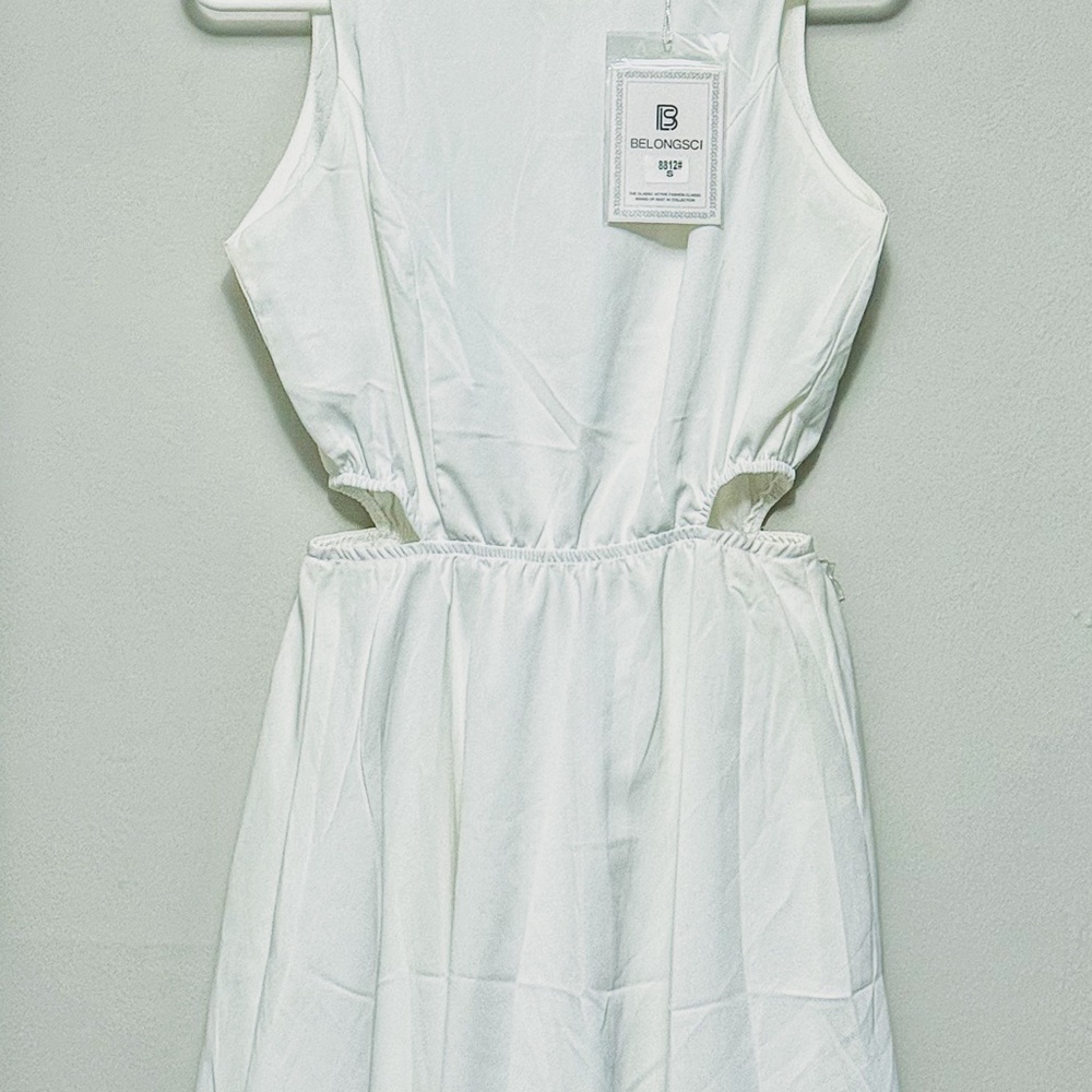 Elegant White Sleeveless Dress with Side Cutouts